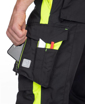 Obrázek z ARDON NEON Pracovní kalhoty s laclem černo-žluté prodloužené 